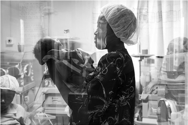 HAWKINS A Mother Holds Up Her Newborn